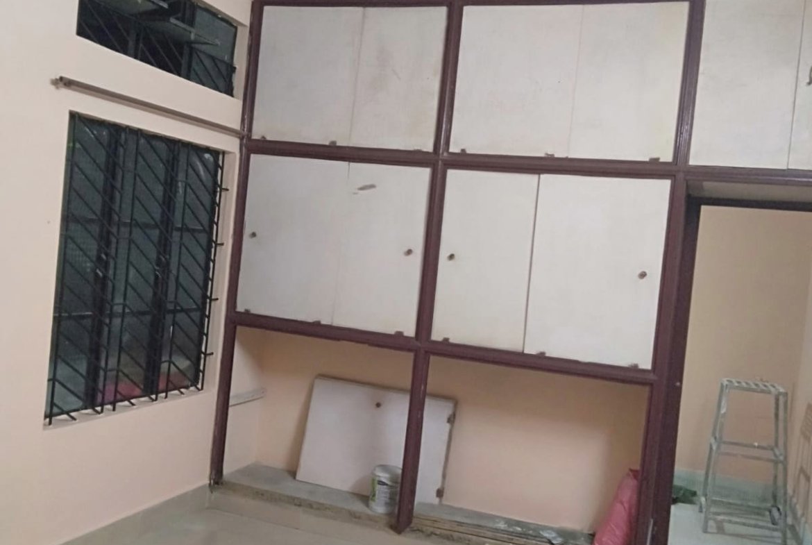 Prime land for sale at Lachit Nagar, Dibrugarh, featuring an Assam-type house with half katha land and car parking, priced at ₹48,00,000