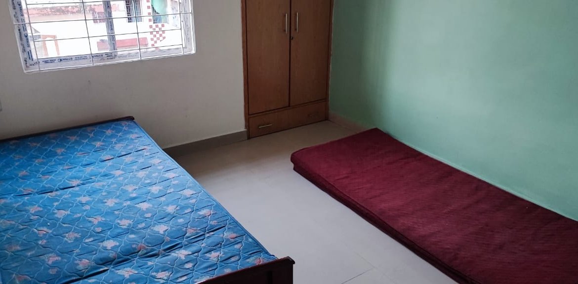 Premium 2 BHK flat for rent in Bhangagarh, Guwahati, 3rd floor, fully furnished with AC, geyser, king-size bed, and refrigerator for ₹20,000