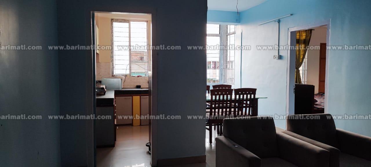 Fully furnished 2 BHK flat for rent at Bhangagarh, Guwahati, 3rd floor, under ₹20,000 with modern amenities including sofa, dining set, and modular kitchen