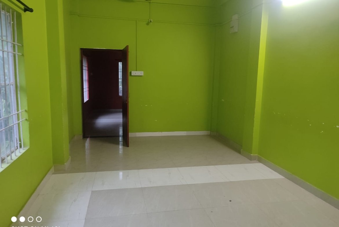 Budget-friendly 2BHK rental apartment in Milan Nagar, Dibrugarh, ground floor with car parking, located in a prime residential area.