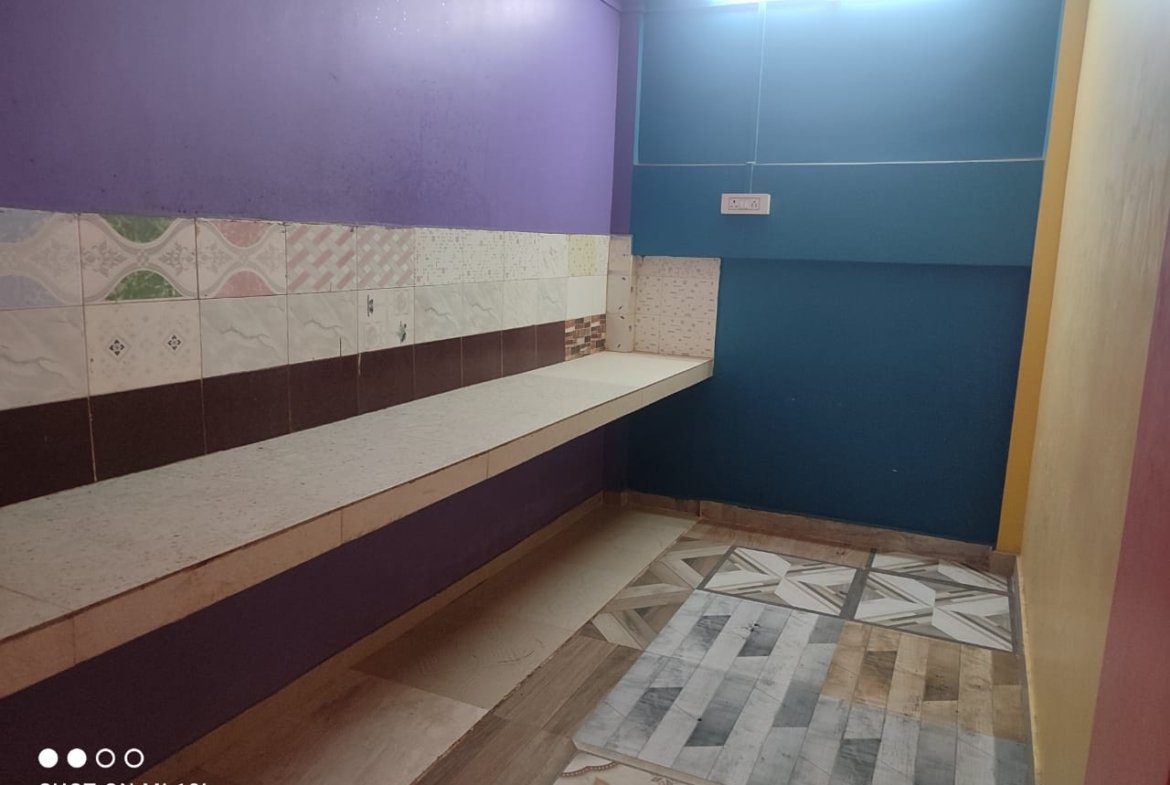 Ground-floor 2BHK flat with car parking at Milan Nagar, Dibrugarh, in a prime location for ₹12,000 monthly rent.