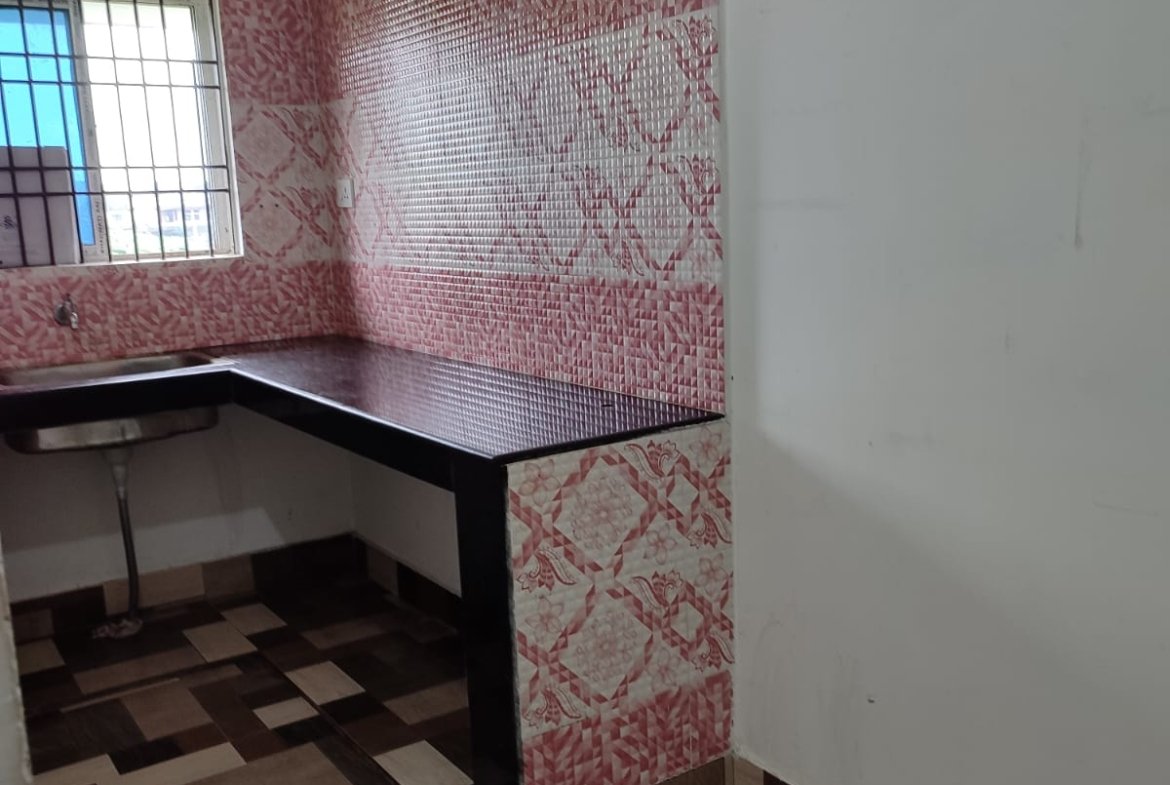 Spacious 2 BHK house with 2 bathrooms for rent at Podum Nagar, Dibrugarh, near colleges and AMC, in a prime first-floor location under ₹10,000.