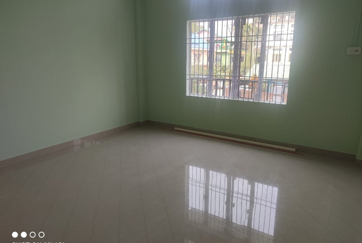 Affordable 3BHK rental house at Milan Nagar, Dibrugarh, featuring a first-floor setup, car parking space, and a central town location for under Rs 10,000