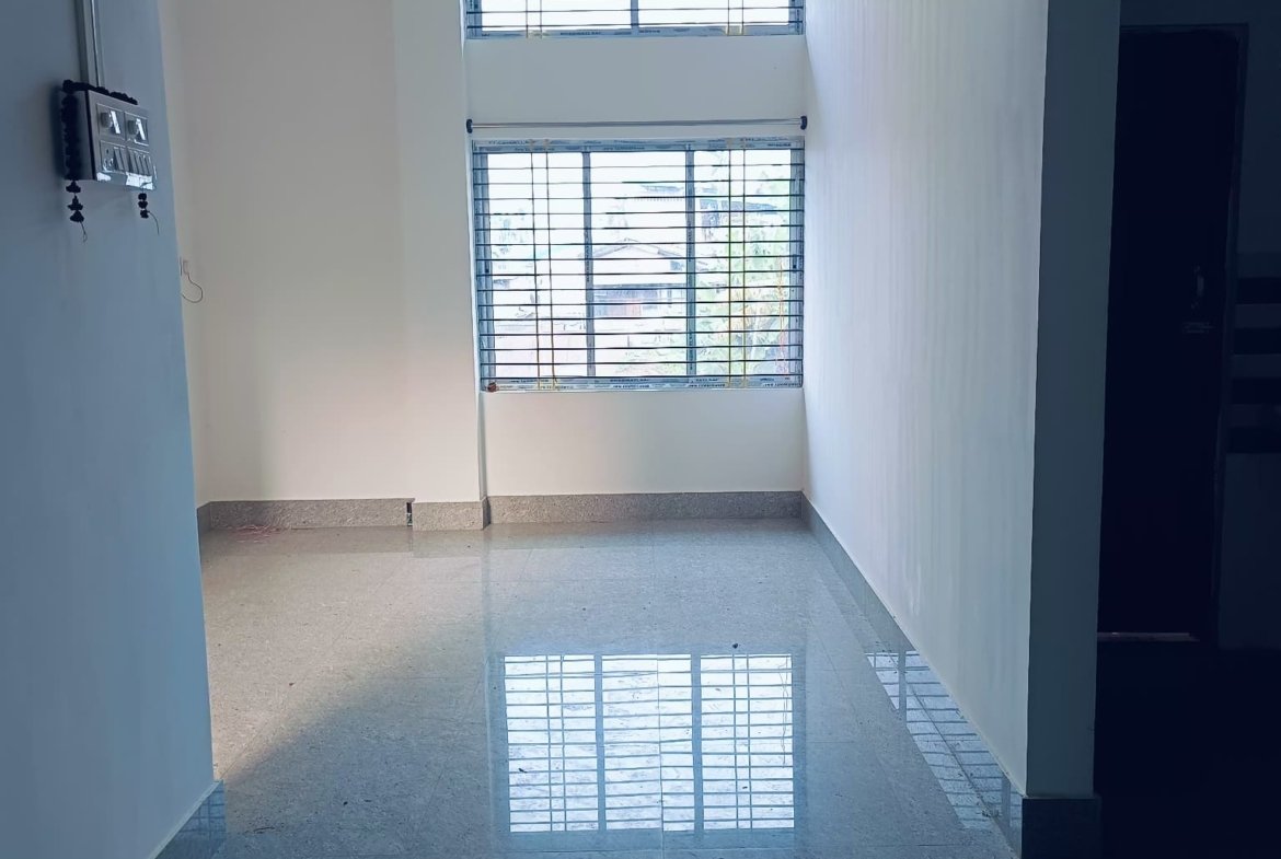 Spacious 2 BHK house for rent at PN Road in Dibrugarh, featuring two bathrooms, a modern design, and a dedicated car parking space on the 1st floor in a prime location.