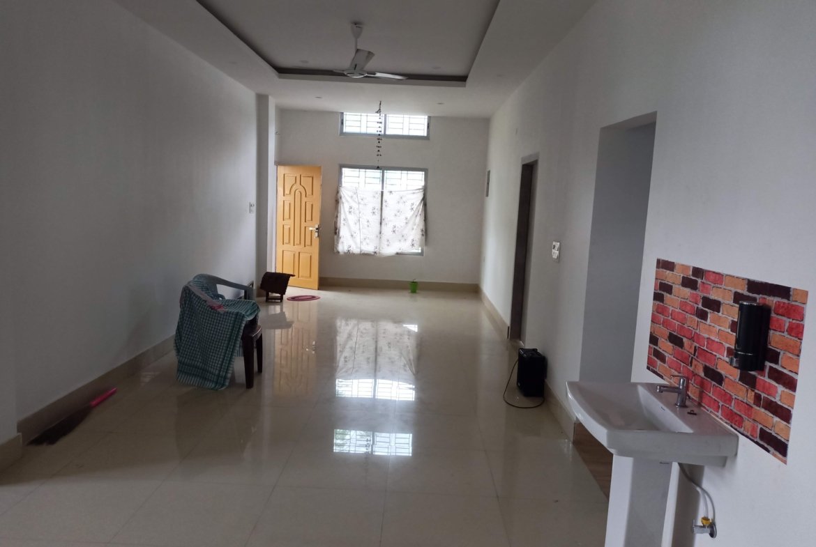 Welcoming 3 BHK rental on the 1st floor in Lokhra, Guwahati, under Rs 15,000, featuring dual bathrooms and a car parking area in a vibrant, central location.