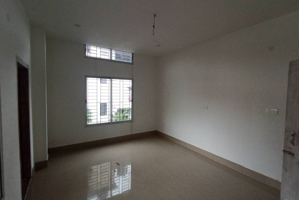 Budget-friendly 3 BHK house for rent in Lokhra, Guwahati, on the 1st floor with two bathrooms and car parking, priced below Rs 15,000 in a prime residential area.