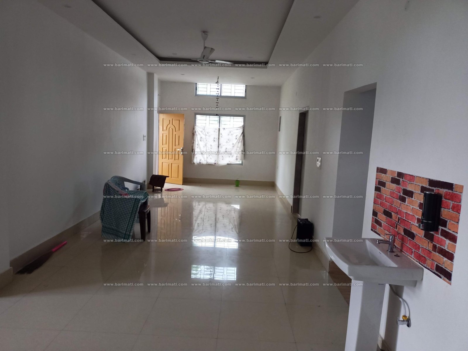 Welcoming 3 BHK rental on the 1st floor in Lokhra, Guwahati, under Rs 15,000, featuring dual bathrooms and a car parking area in a vibrant, central location.