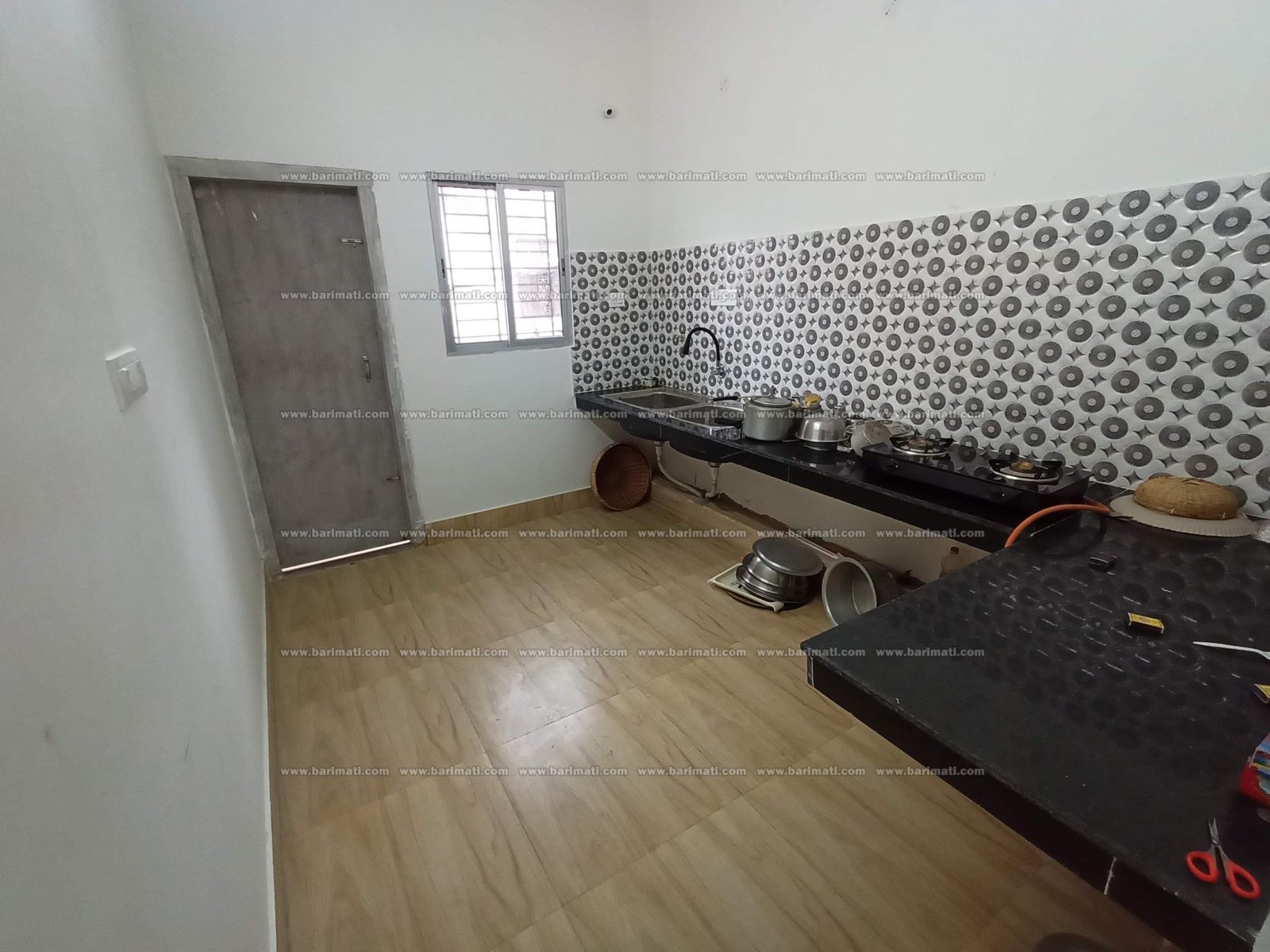 Affordable 3 BHK flat for rent in Lokhra, Guwahati, on the 1st floor with car parking and dual bathrooms, all within Rs 15,000 in a lively, prime area.