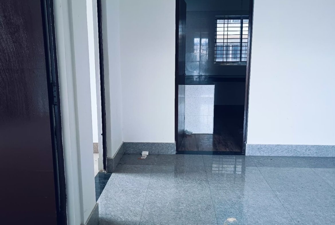 Affordable 2 BHK home for rent at PN Road, Dibrugarh, offering spacious interiors, a car parking area, and a secure, peaceful environment for comfortable living.