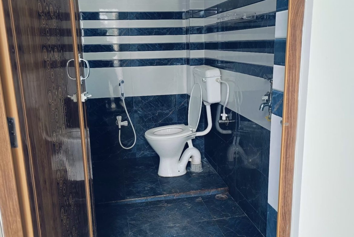 Premium 2 BHK house for rent at PN Road, located in one of the best areas of Dibrugarh, featuring modern amenities, two bathrooms, and a dedicated car parking spot.