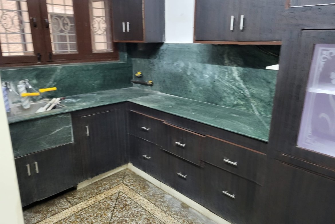 Low-cost two-bedroom home on GMS Road, Dehradun, offering secure parking space and a comfortable living setup for families.